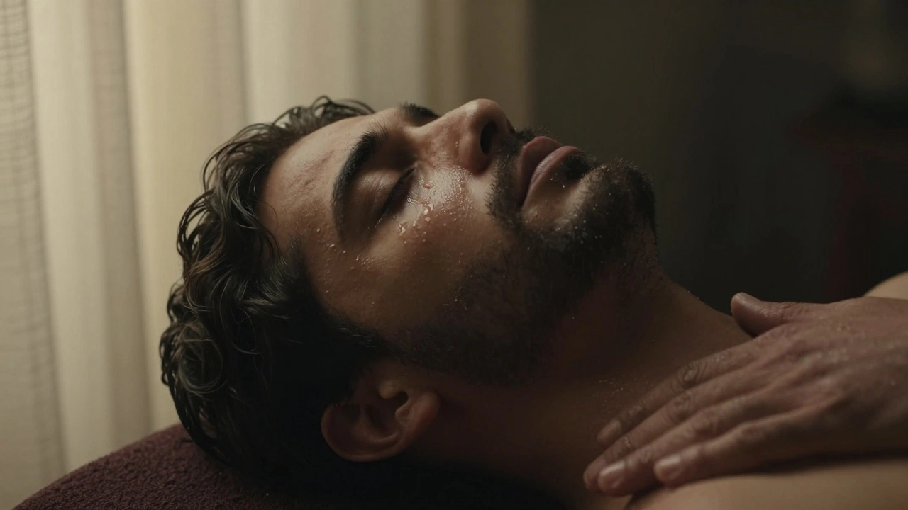 A man's face during a lingam massage, eyes closed, tears falling, bathed in soft golden light, expressing deep emotional release.